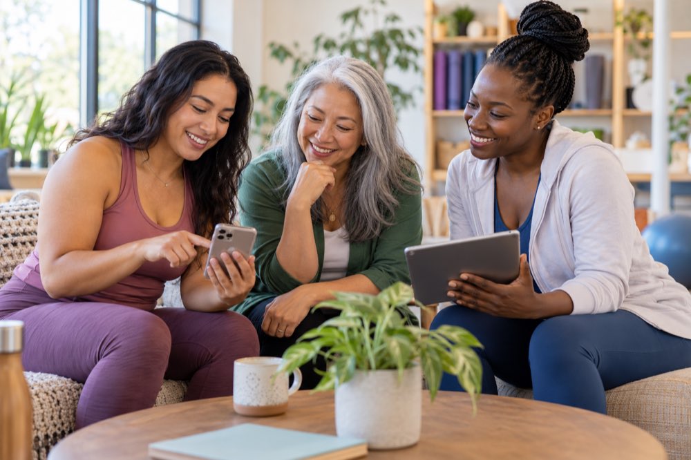 Women discussing digital health tools together